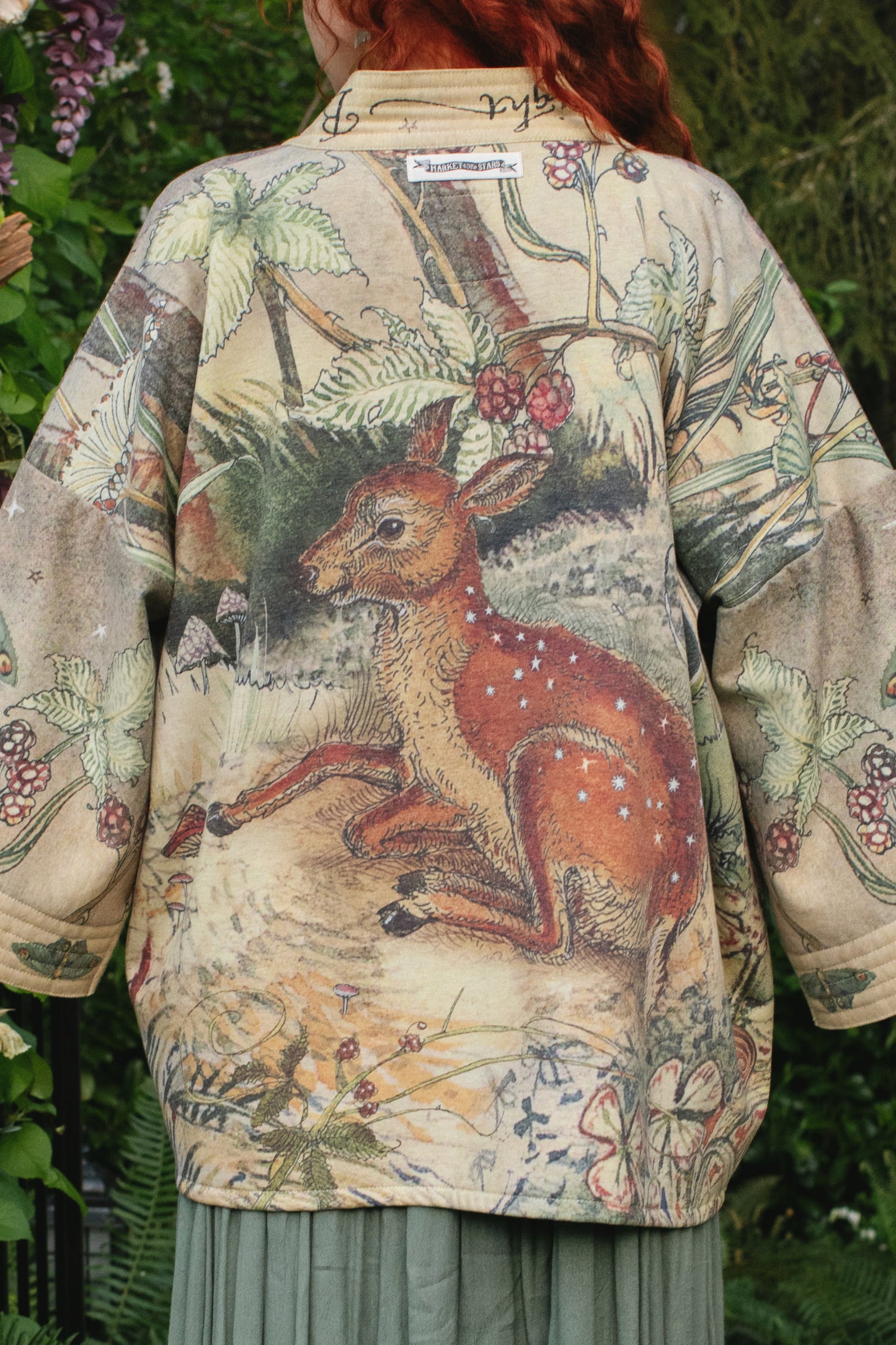 Model wearing the Lovelight Cottage Cardigan ft artwork by world-renowned illustrator Charles van Sandwyk - Market of Stars