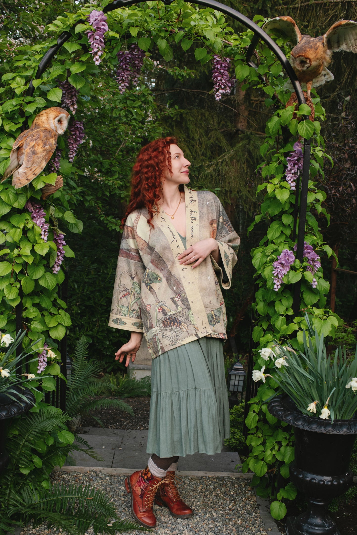 Model wearing the Lovelight Cottage Cardigan ft artwork by world-renowned illustrator Charles van Sandwyk - Market of Stars