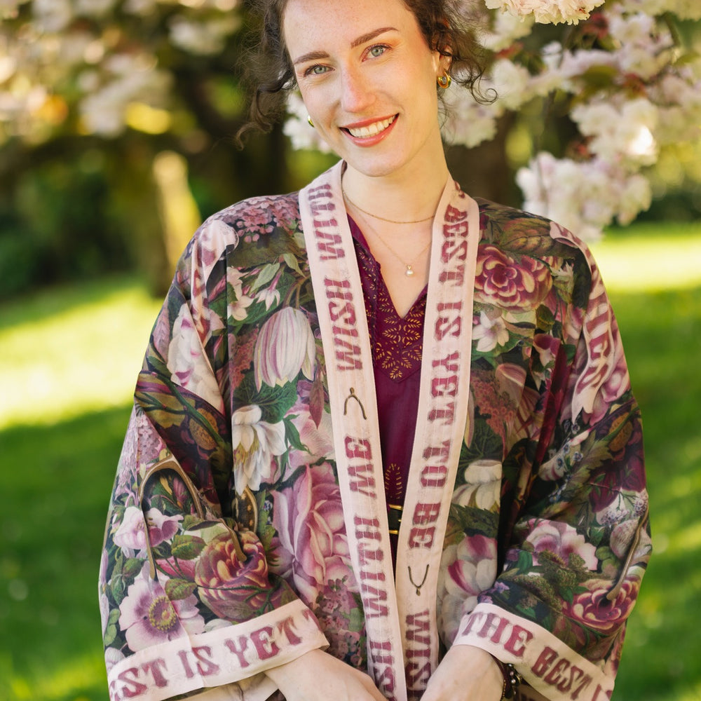 Model wearing cropped kimono featuring gold wishbone–vintage coin–evening star–dandelion–and spring floral collage with “Make a wish” banner – Market of Stars