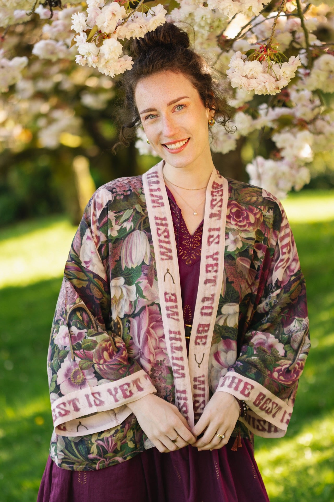 Model wearing cropped kimono featuring gold wishbone–vintage coin–evening star–dandelion–and spring floral collage with “Make a wish” banner – Market of Stars
