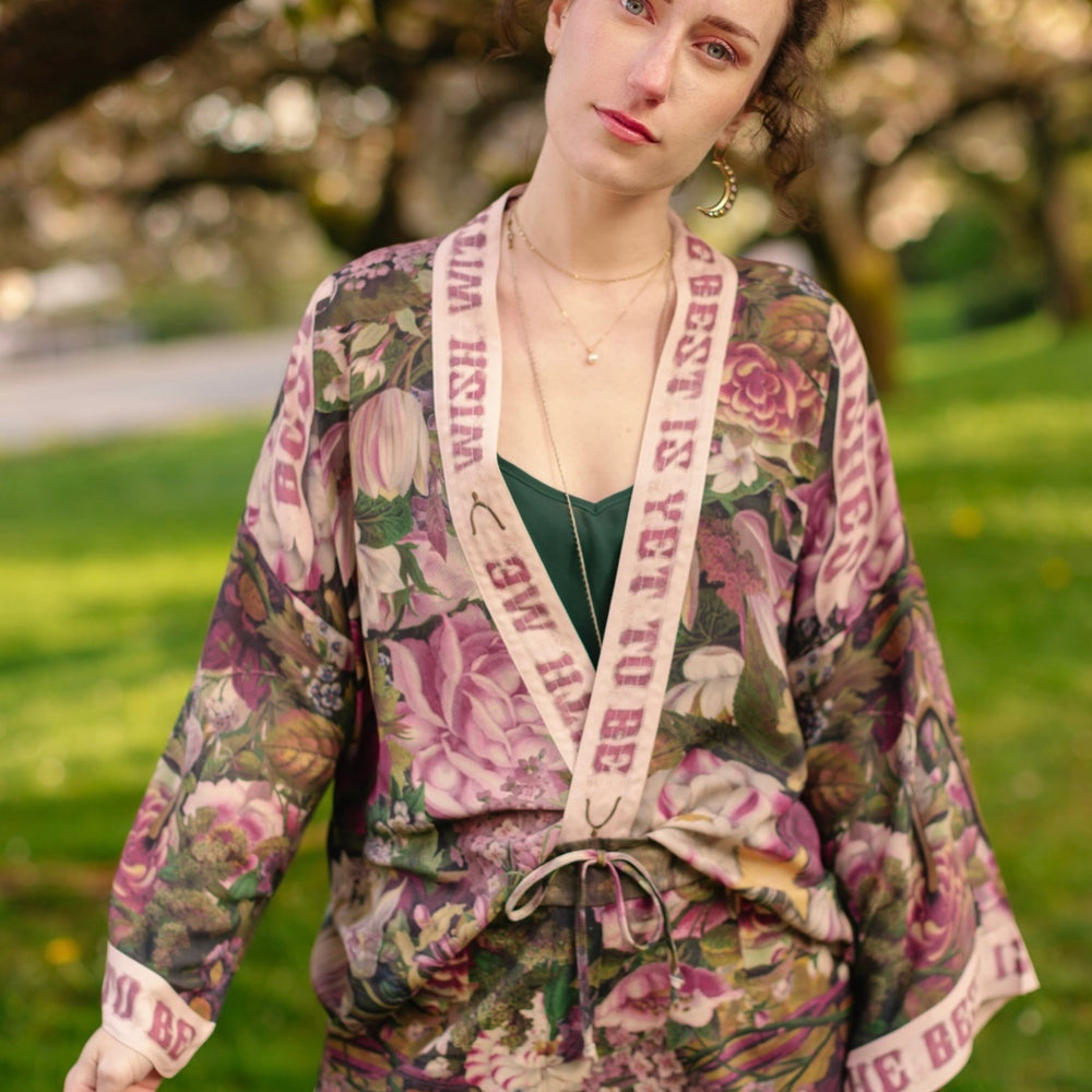 
                  
                    Model wearing cropped kimono featuring gold wishbone–vintage coin–evening star–dandelion–and spring floral collage with “Make a wish” banner – Market of Stars
                  
                