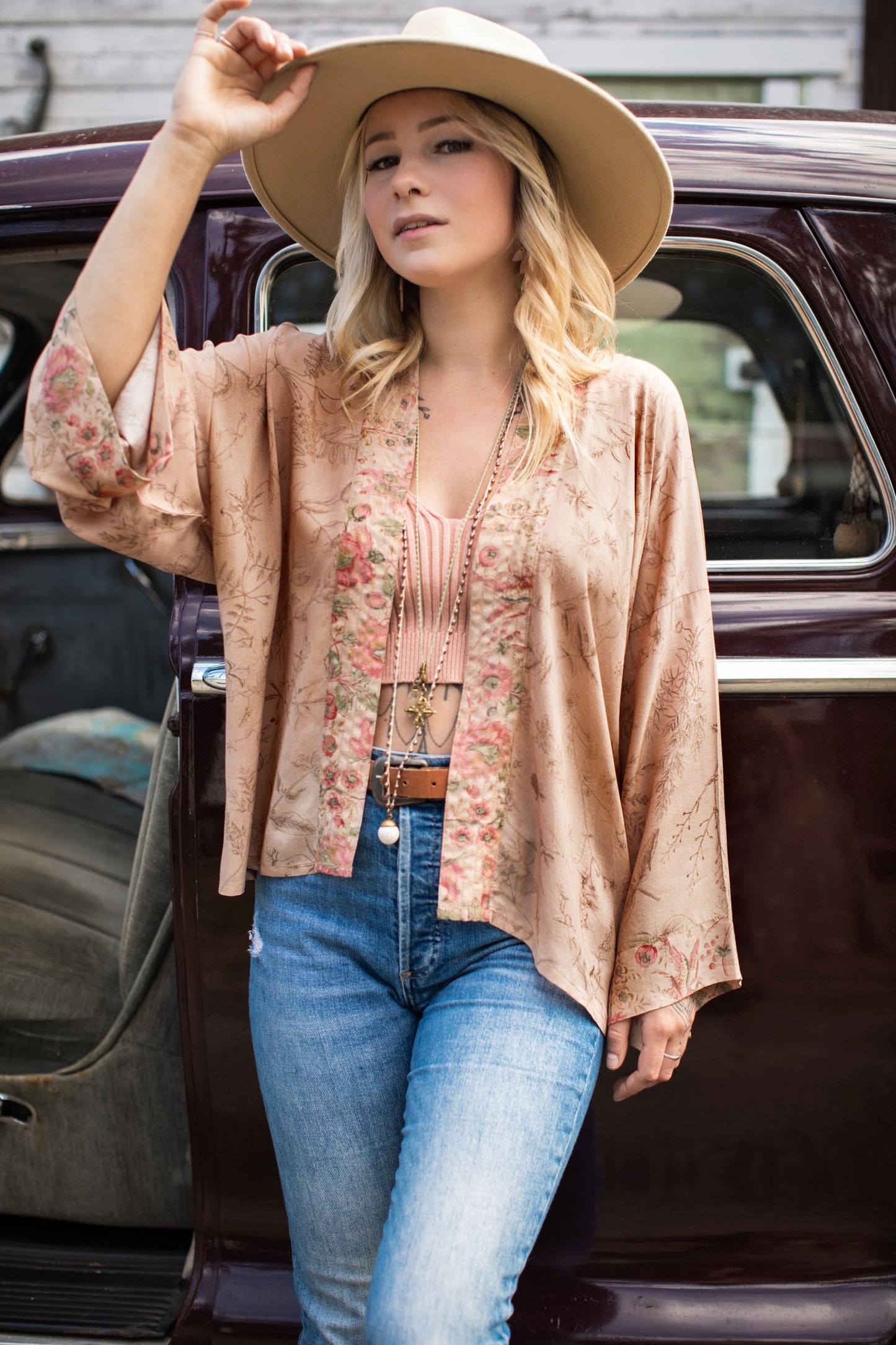 Model wearing map print kimono featuring a reimagined 1846 artwork titled A Map of the Open Country of a Woman’s Heart – Market of Stars