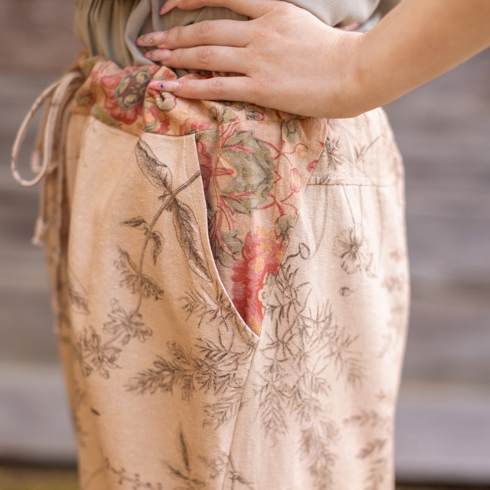 
                  
                    Model wearing artist pants in oat featuring reimagined vintage 1846 map of a woman’s heart with playful updated place names – Market of Stars
                  
                