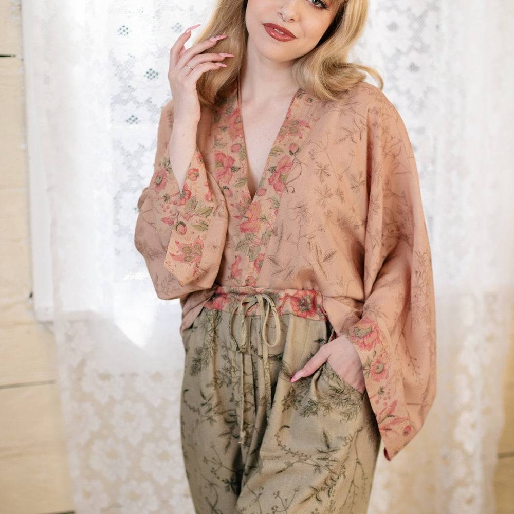 
                  
                    Model wearing artist pants in sage featuring reimagined vintage 1846 map of a woman’s heart with playful updated place names – Market of Stars
                  
                