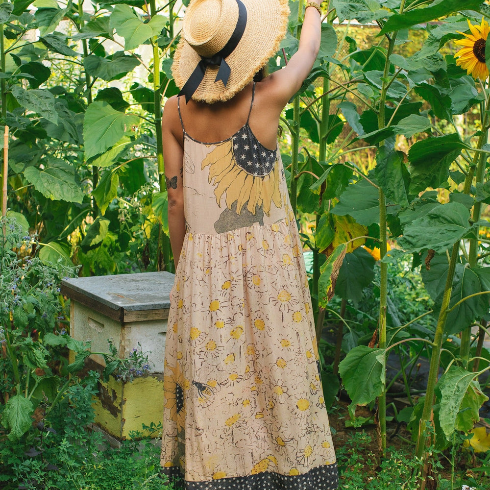 
                  
                    Model wearing the Milk & Honey Bohéme Slip Dress featuring nostalgic 1904 Brooklyn artwork, vintage woodcut stars, and Hoytema’s antique floral print – Market of Stars.
                  
                