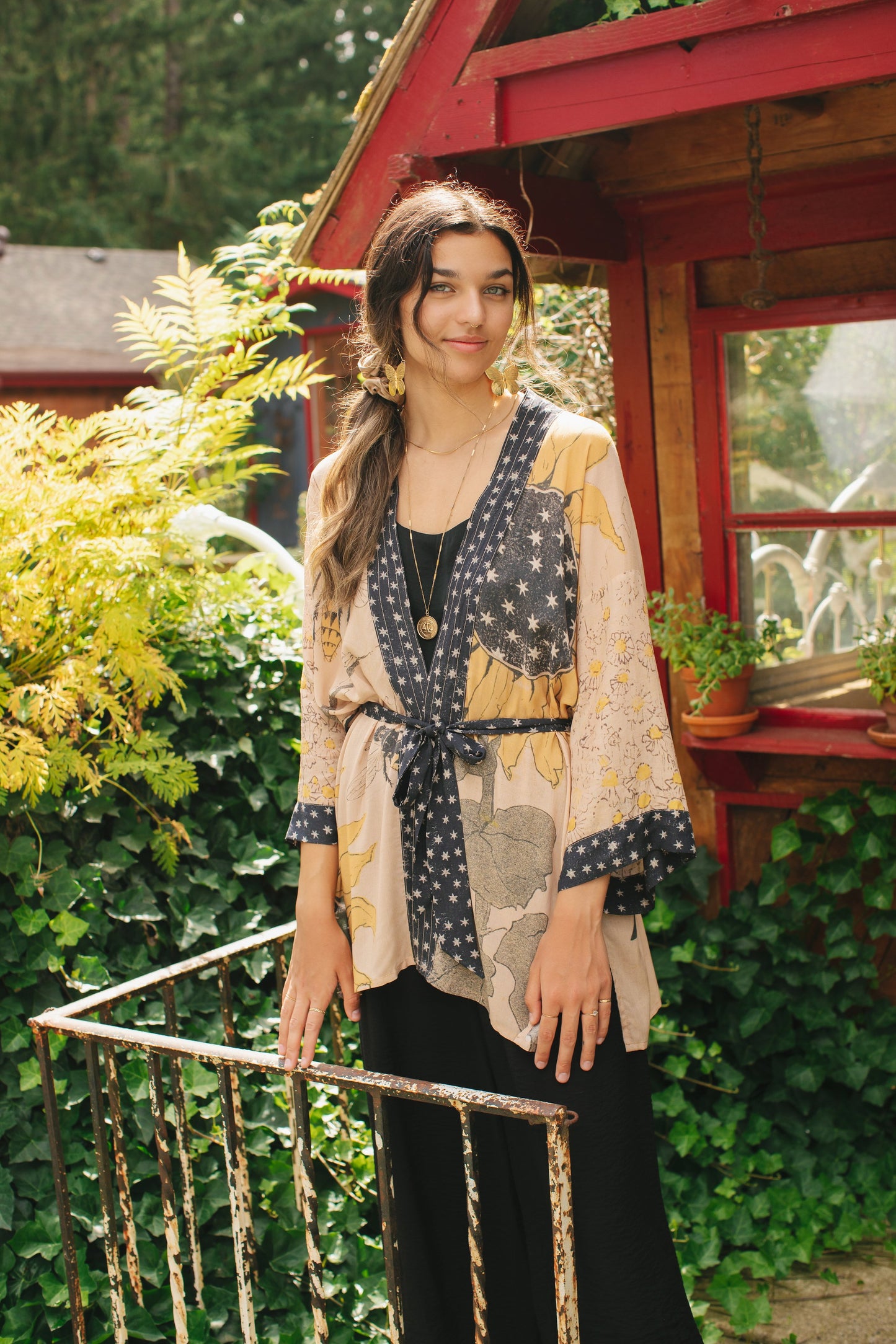 Model wearing our matinee length kimono featuring vintage-inspired Milk & Honey print with 1904 typography and floral woodcuts – Market of Stars