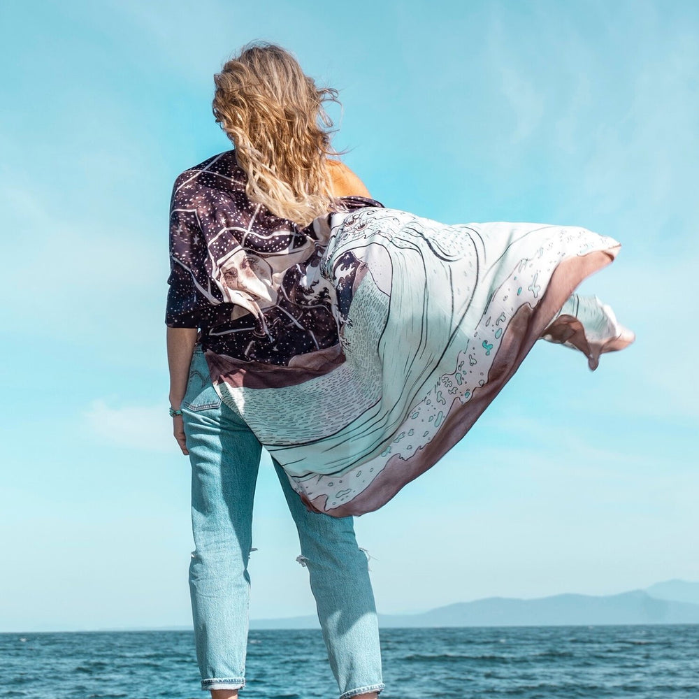 Model wearing Moonstruck Goddess Duster featuring original artwork by Leslie Love, inspired by the ocean, the night sky, and the artist’s handmade botanical inks – Market of Stars.