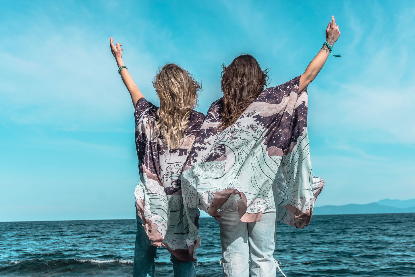 Model wearing Moonstruck Goddess Duster featuring original artwork by Leslie Love, inspired by the ocean, the night sky, and the artist’s handmade botanical inks – Market of Stars.