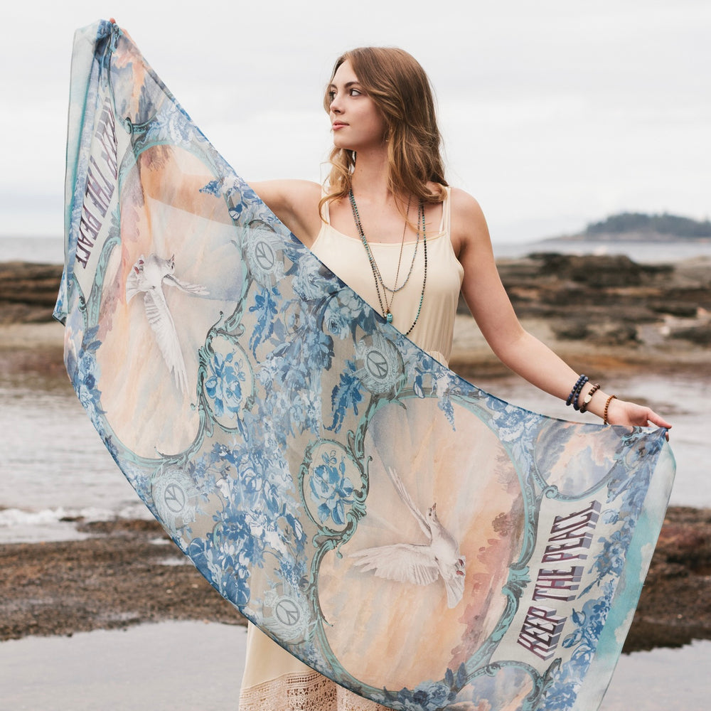 Model wearing a light, airy bamboo-based viscose scarf to wrap yourself in good vibes, wanderlust, and a little rebellion - Market of Stars
