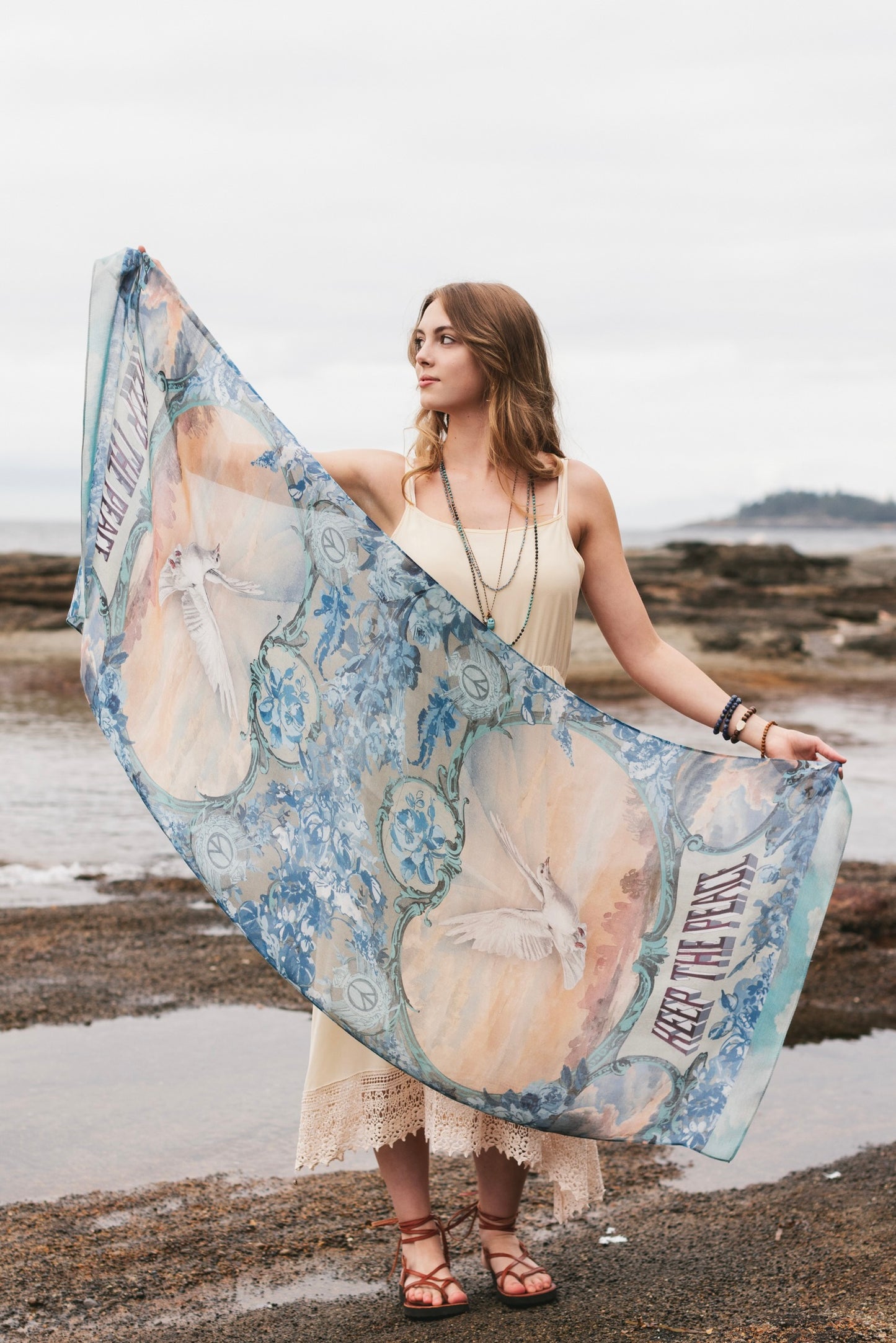Model wearing a light, airy bamboo-based viscose scarf to wrap yourself in good vibes, wanderlust, and a little rebellion - Market of Stars