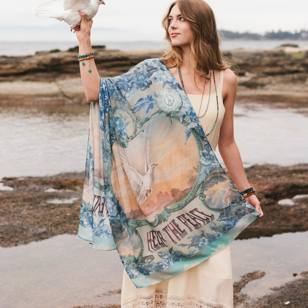 
                  
                    Model wearing a light, airy bamboo-based viscose scarf to wrap yourself in good vibes, wanderlust, and a little rebellion - Market of Stars
                  
                