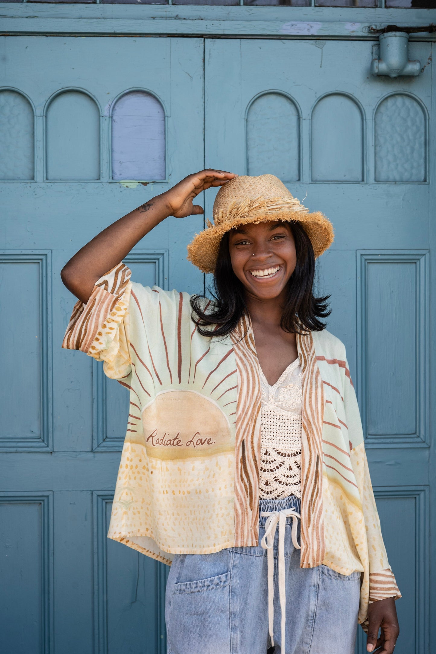 Model wearing Peace, Wine & Sunshine Bohéme Slip Dress featuring botanical collages and playful peace, wine and sunshine lettering on the hem – Market of Stars.