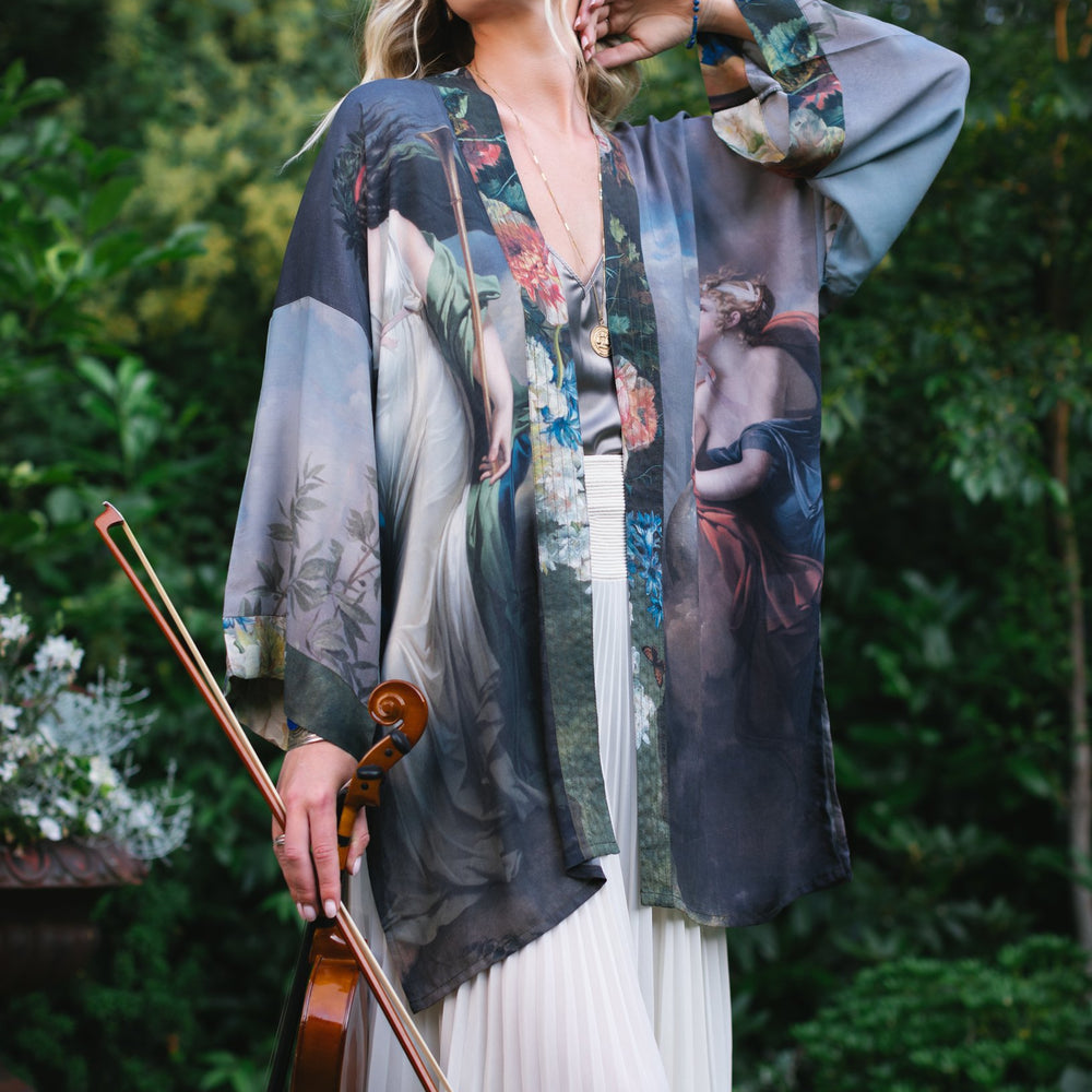 Model wearing Peace, Wine & Sunshine Bohéme Slip Dress featuring botanical collages and playful peace, wine and sunshine lettering on the hem – Market of Stars.