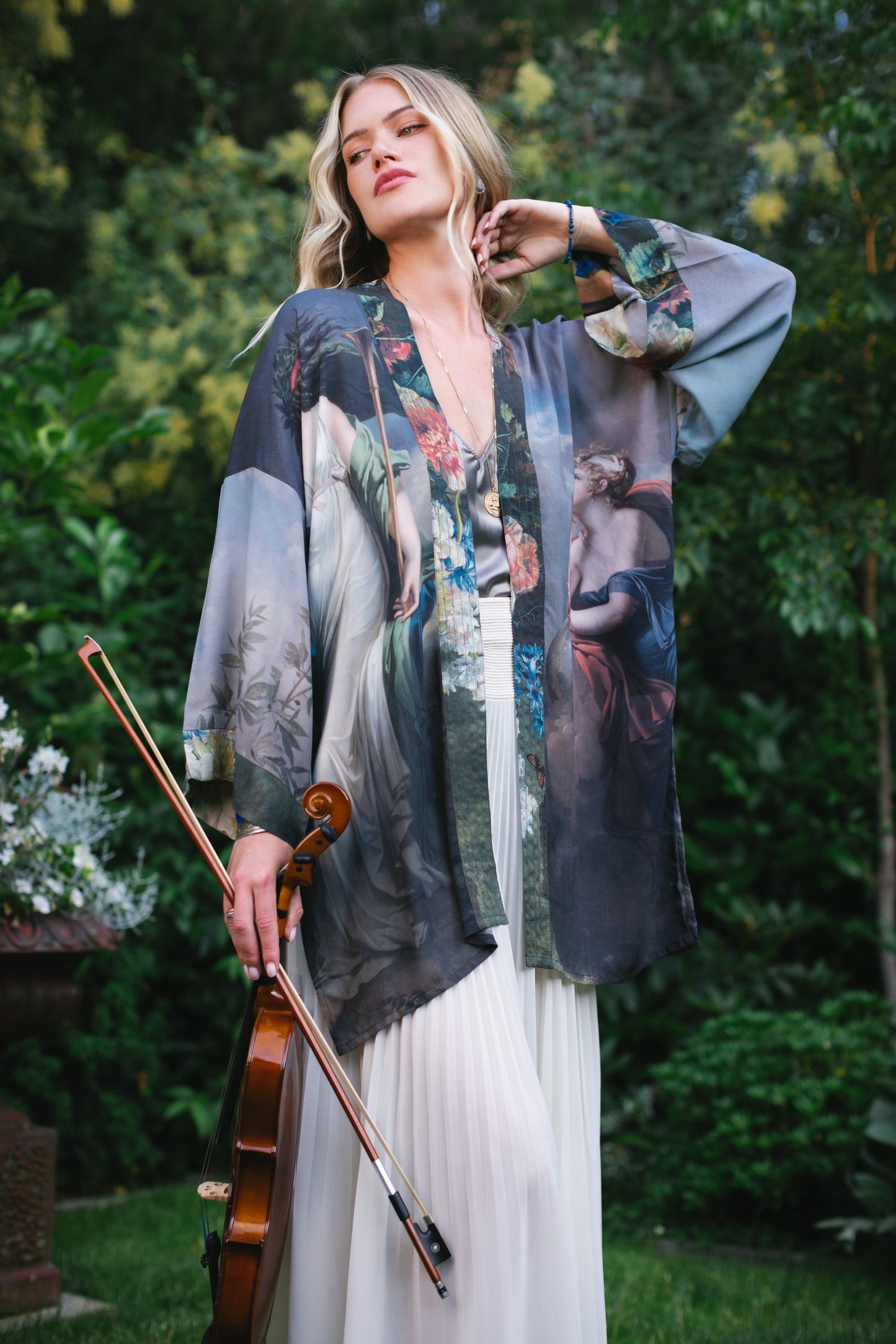 Model wearing Peace, Wine & Sunshine Bohéme Slip Dress featuring botanical collages and playful peace, wine and sunshine lettering on the hem – Market of Stars.