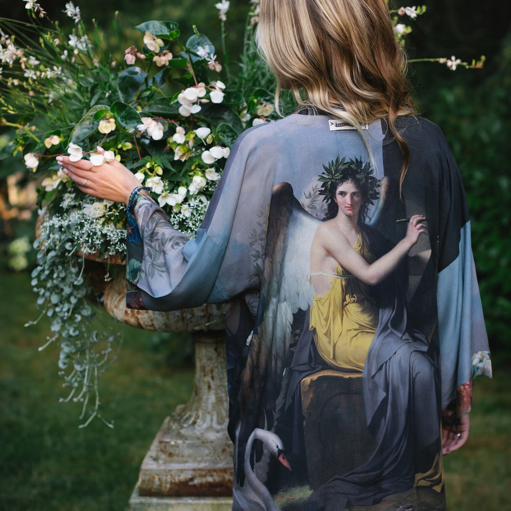 Model wearing Peace, Wine & Sunshine Bohéme Slip Dress featuring botanical collages and playful peace, wine and sunshine lettering on the hem – Market of Stars.
