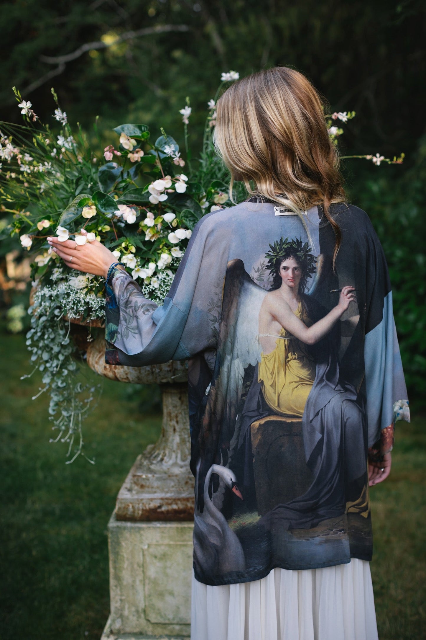 Model wearing Peace, Wine & Sunshine Bohéme Slip Dress featuring botanical collages and playful peace, wine and sunshine lettering on the hem – Market of Stars.