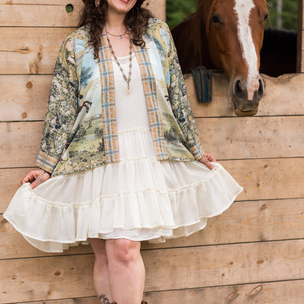 Model wearing a bamboo-viscose cropped kimono duster made for everyday adventures with a whimsical print celebrating one's unbridled spirit of adventure - Market of Stars