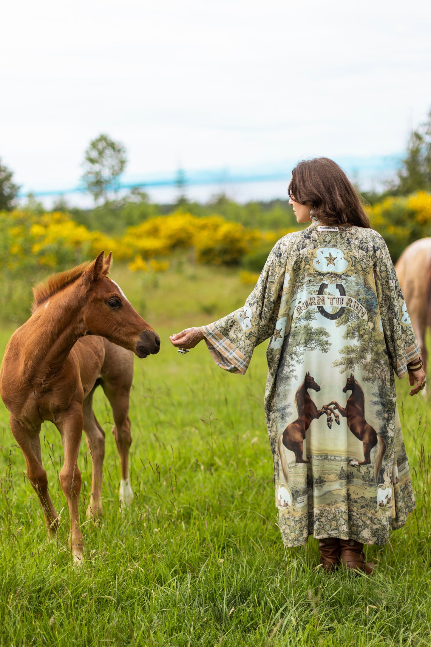 Model wearing a bamboo-viscose kimono duster robe made for everyday adventures with a whimsical print celebrating one's unbridled spirit of adventure - Market of Stars