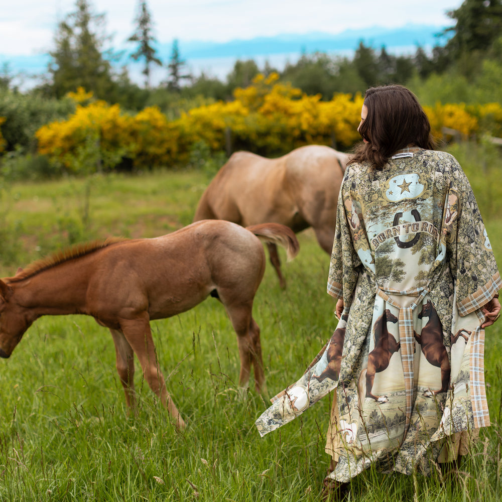 
                  
                    Model wearing a bamboo-viscose kimono duster robe made for everyday adventures with a whimsical print celebrating one's unbridled spirit of adventure - Market of Stars
                  
                