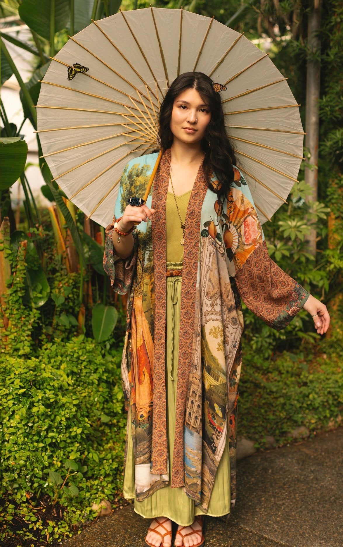 Model wearing Peace, Wine & Sunshine Bohéme Slip Dress featuring botanical collages and playful peace, wine and sunshine lettering on the hem – Market of Stars.