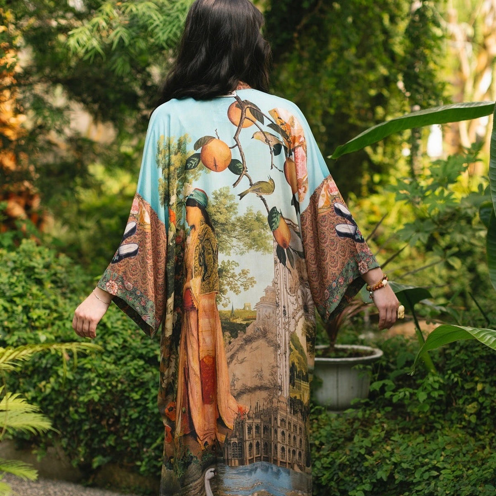 Model wearing Peace, Wine & Sunshine Bohéme Slip Dress featuring botanical collages and playful peace, wine and sunshine lettering on the hem – Market of Stars.