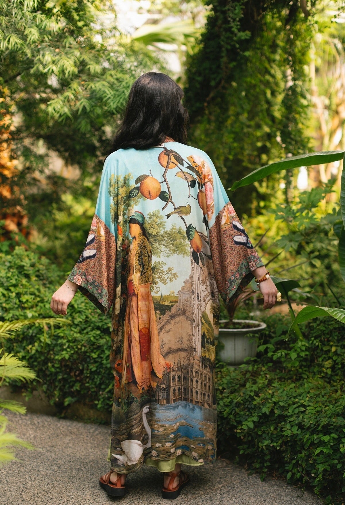 Model wearing Peace, Wine & Sunshine Bohéme Slip Dress featuring botanical collages and playful peace, wine and sunshine lettering on the hem – Market of Stars.