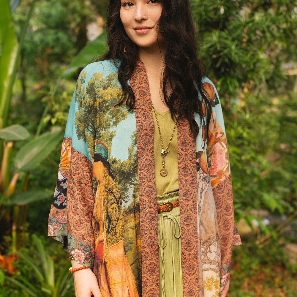 
                  
                    Model wearing Peace, Wine & Sunshine Bohéme Slip Dress featuring botanical collages and playful peace, wine and sunshine lettering on the hem – Market of Stars.
                  
                