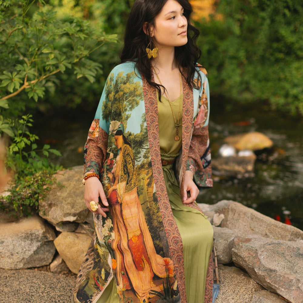 
                  
                    Model wearing Peace, Wine & Sunshine Bohéme Slip Dress featuring botanical collages and playful peace, wine and sunshine lettering on the hem – Market of Stars.
                  
                