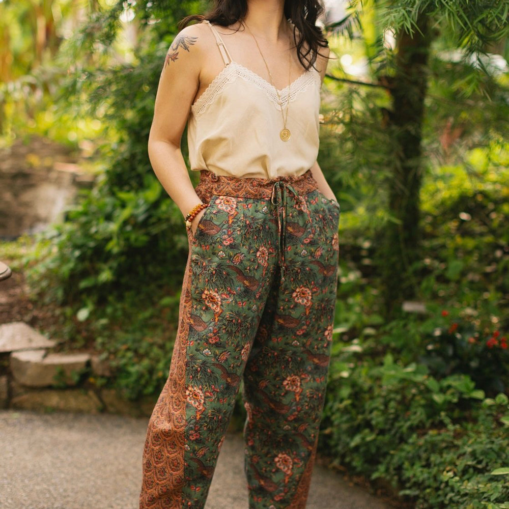 
                  
                    Model wearing Peace, Wine & Sunshine Bohéme Slip Dress featuring botanical collages and playful peace, wine and sunshine lettering on the hem – Market of Stars.
                  
                