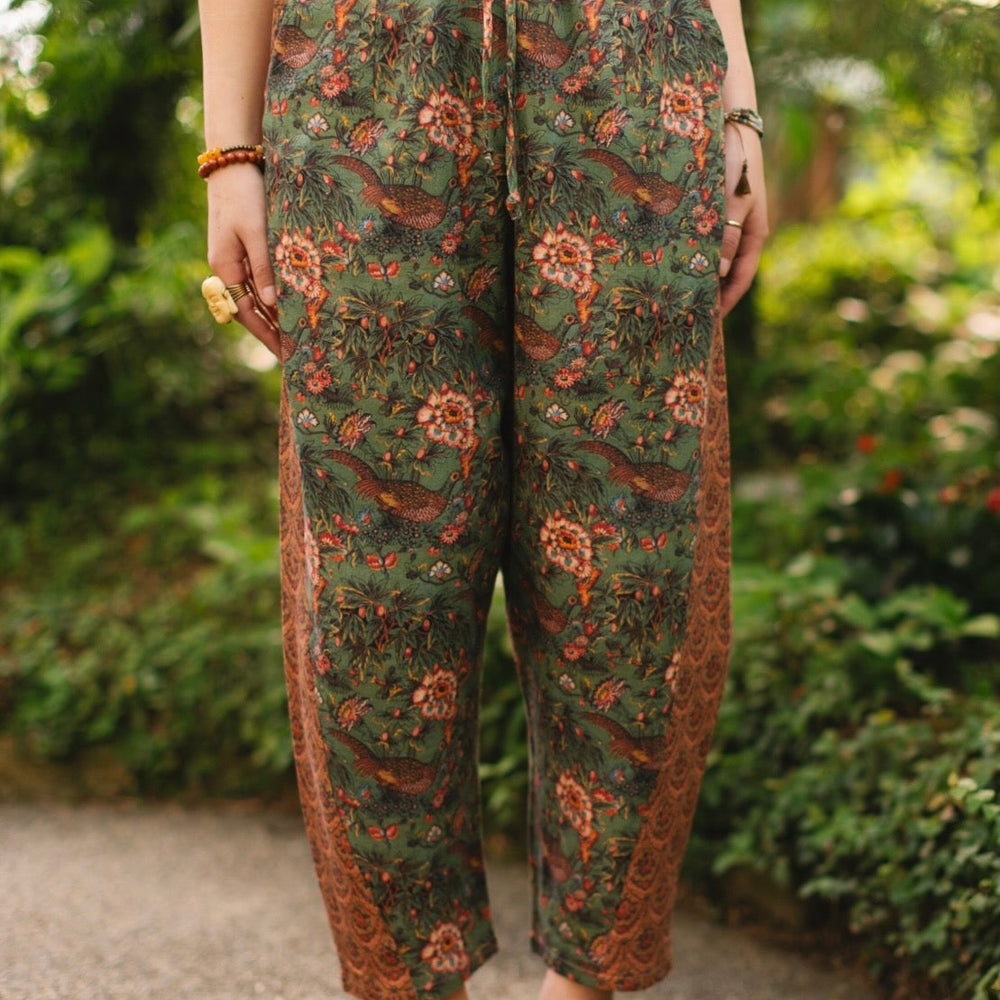 
                  
                    Model wearing Peace, Wine & Sunshine Bohéme Slip Dress featuring botanical collages and playful peace, wine and sunshine lettering on the hem – Market of Stars.
                  
                