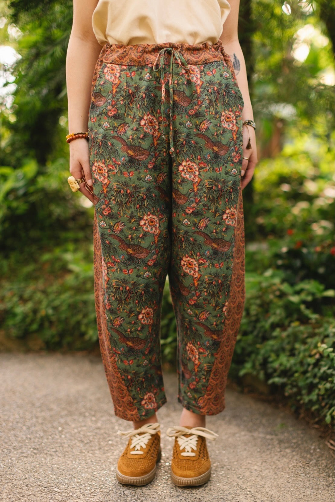 Model wearing Peace, Wine & Sunshine Bohéme Slip Dress featuring botanical collages and playful peace, wine and sunshine lettering on the hem – Market of Stars.