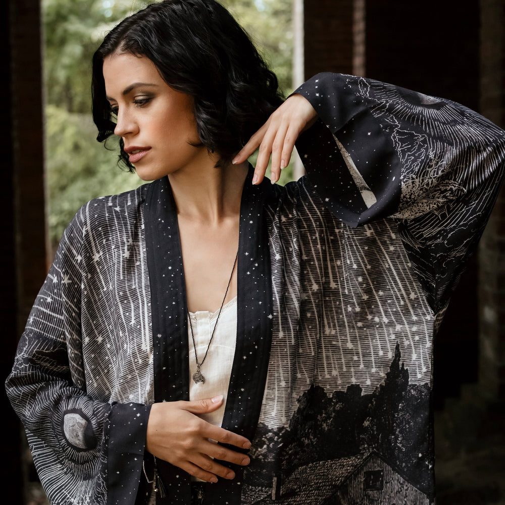 Model wearing our Stargazer cropped kimono featuring an antique engraving of a meteor shower and moonlit astronomy imagery – Market of Stars