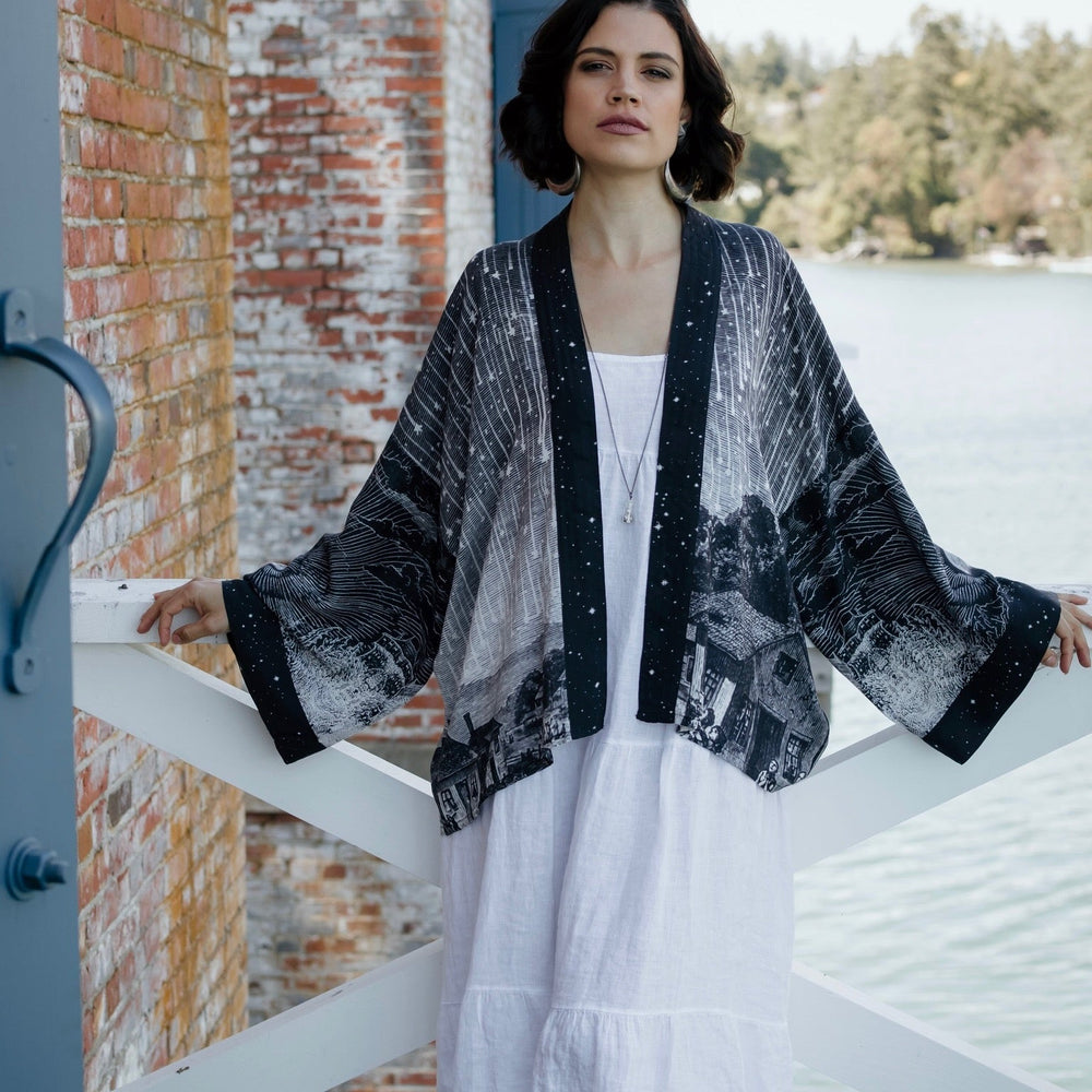 Model wearing our Stargazer cropped kimono featuring an antique engraving of a meteor shower and moonlit astronomy imagery – Market of Stars