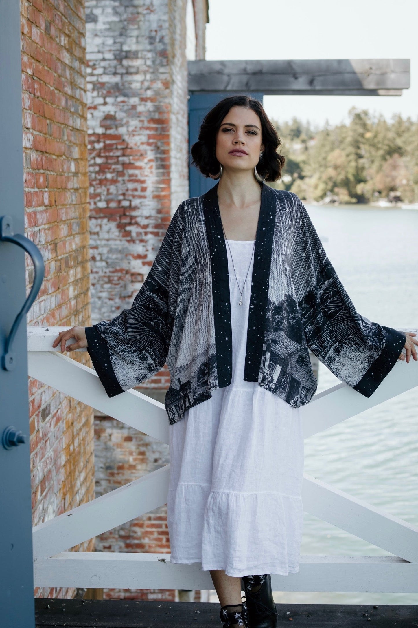 Model wearing our Stargazer cropped kimono featuring an antique engraving of a meteor shower and moonlit astronomy imagery – Market of Stars