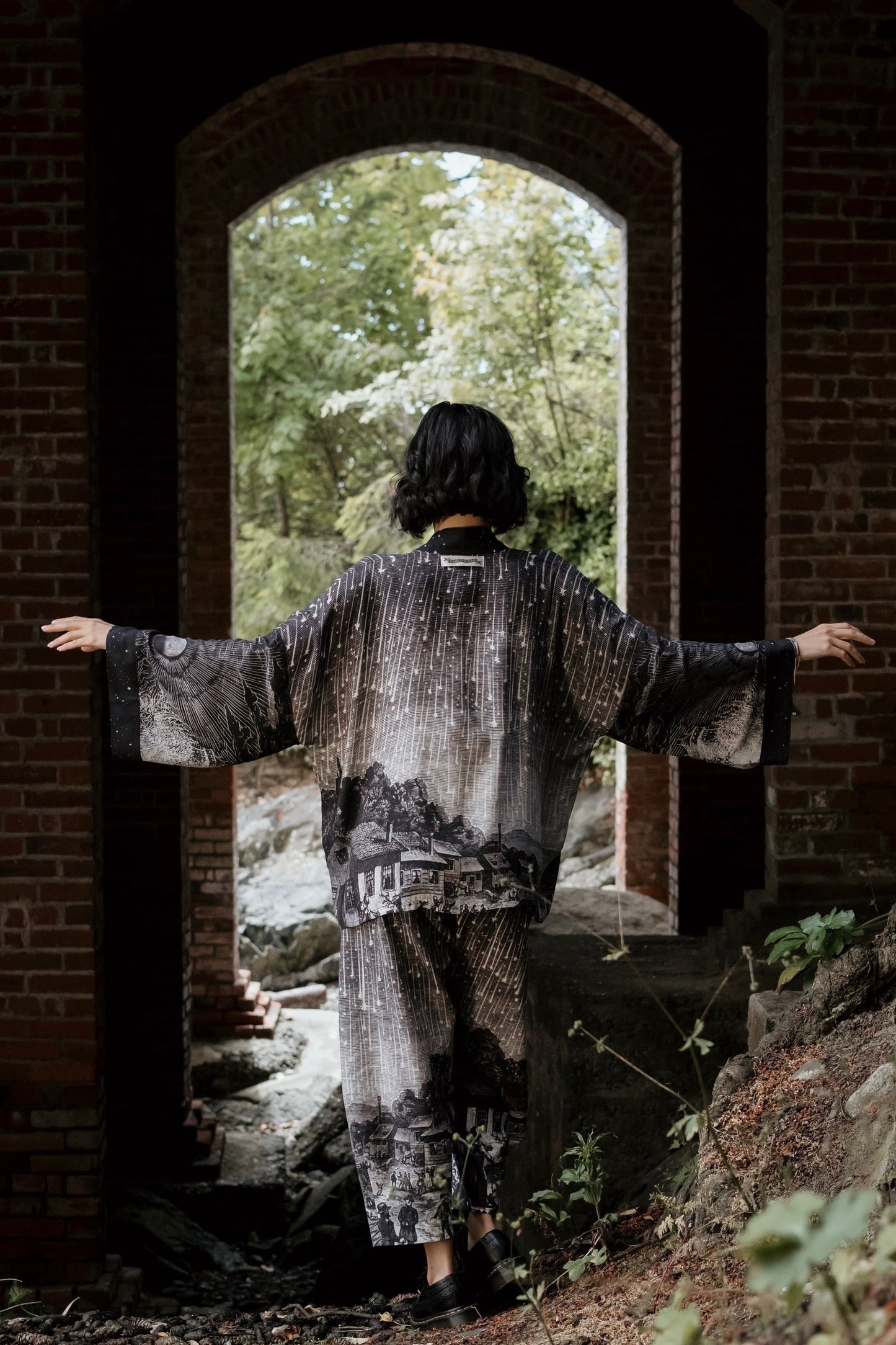 Model wearing our Stargazer cropped kimono featuring an antique engraving of a meteor shower and moonlit astronomy imagery – Market of Stars