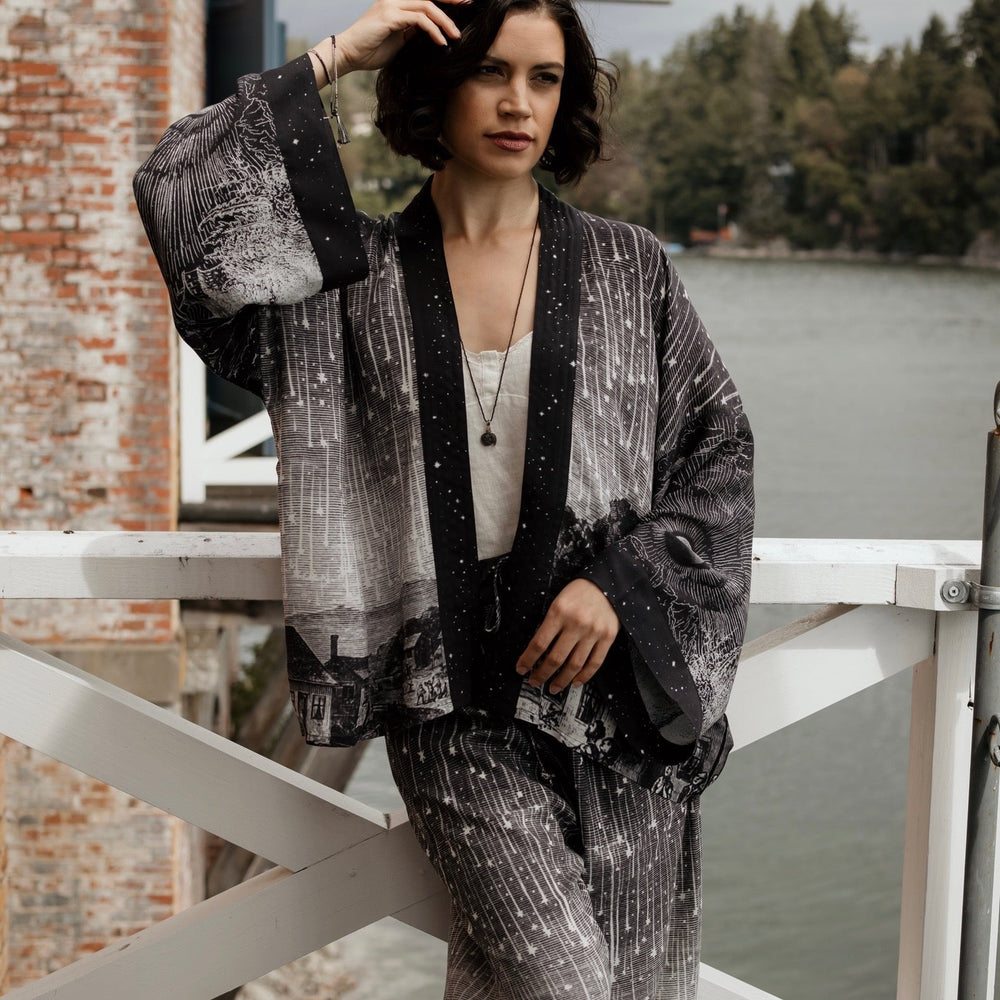 
                  
                    Model wearing our Stargazer cropped kimono featuring an antique engraving of a meteor shower and moonlit astronomy imagery – Market of Stars
                  
                