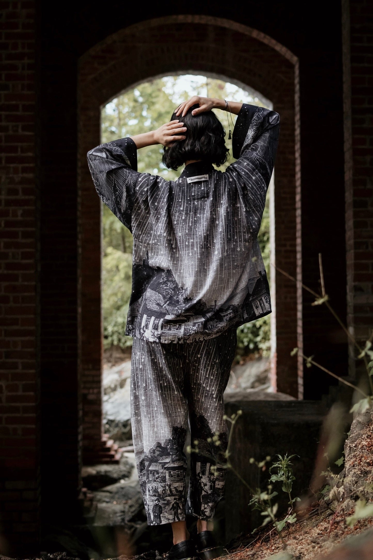 Model wearing our Stargazer cropped kimono featuring an antique engraving of a meteor shower and moonlit astronomy imagery – Market of Stars