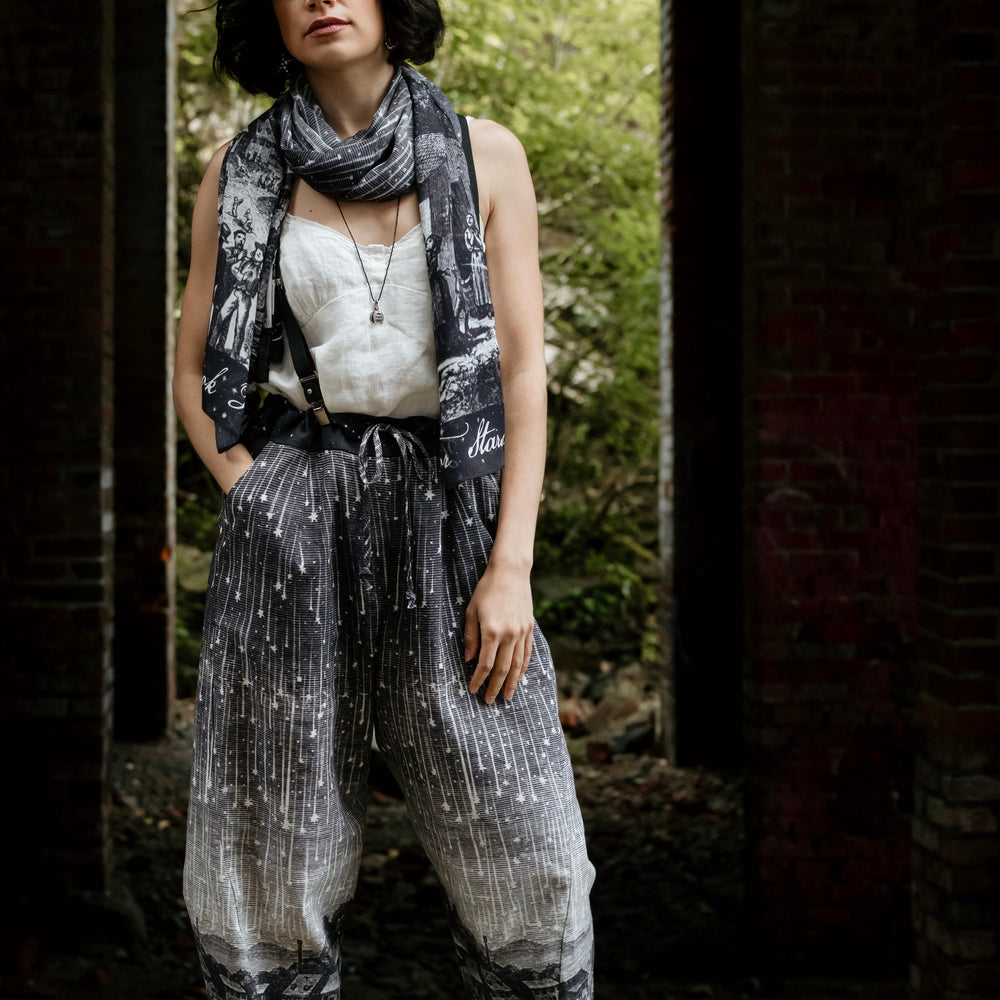 Model wearing Peace, Wine & Sunshine Bohéme Slip Dress featuring botanical collages and playful peace, wine and sunshine lettering on the hem – Market of Stars.