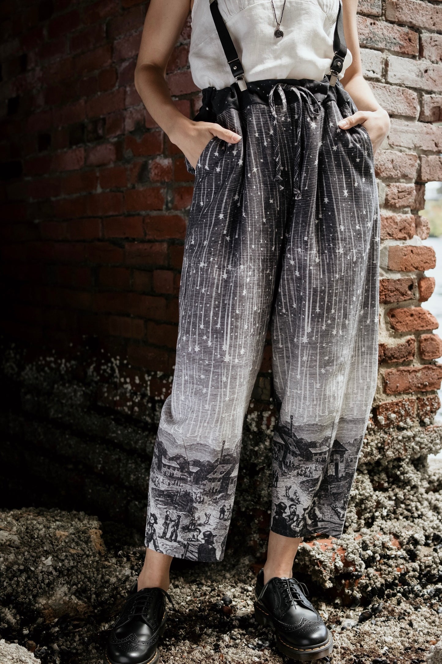 Model wearing Peace, Wine & Sunshine Bohéme Slip Dress featuring botanical collages and playful peace, wine and sunshine lettering on the hem – Market of Stars.