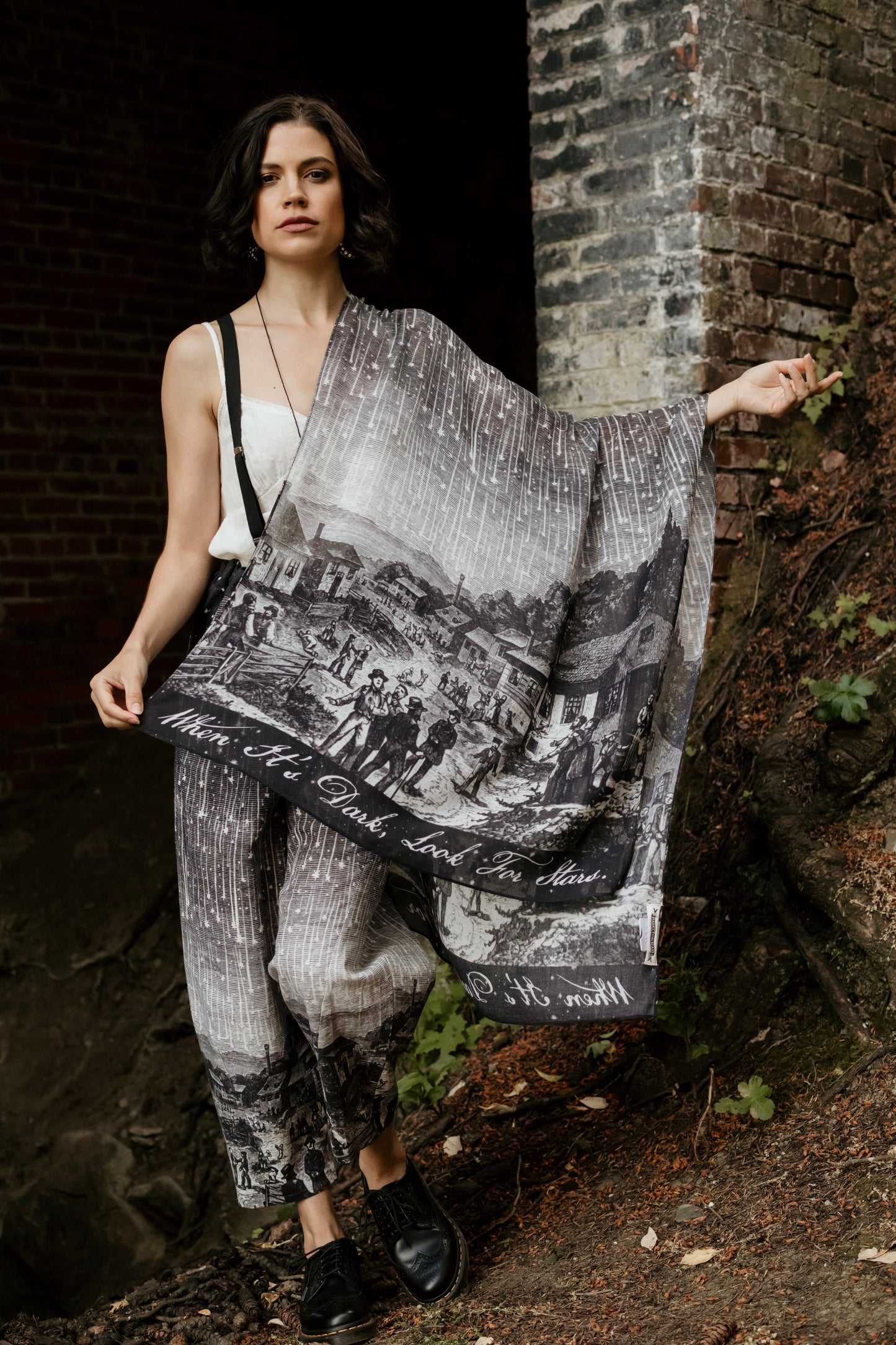 Model wearing the Stargazer Scarf featuring antique night sky illustrations and the quote "When it's dark, look for stars" – Market of Stars