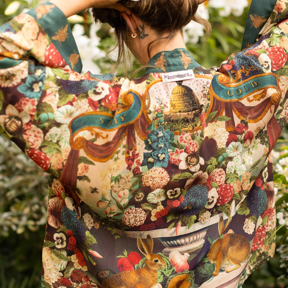 
                  
                    Model wearing Stay Gold Pixie Duster featuring wildflowers, bees, bunny rabbits and poetic vintage collage in cropped length – Market of Stars
                  
                
