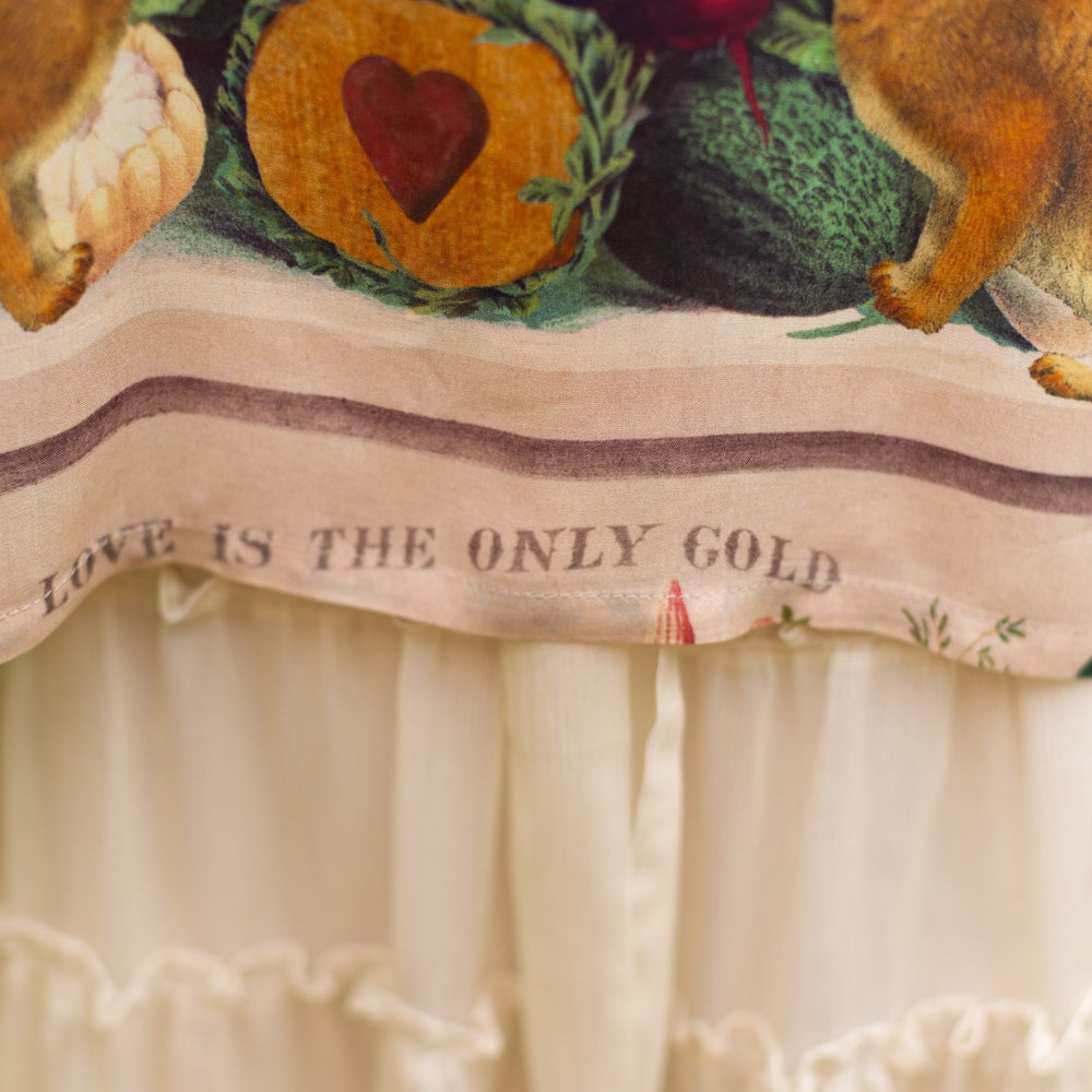 
                  
                    Model wearing Stay Gold Pixie Duster featuring wildflowers, bees, bunny rabbits and poetic vintage collage in cropped length – Market of Stars
                  
                