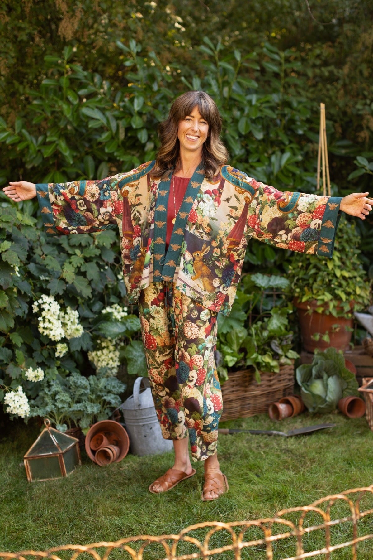 Model wearing Stay Gold Pixie Duster featuring wildflowers, bees, bunny rabbits and poetic vintage collage in cropped length – Market of Stars