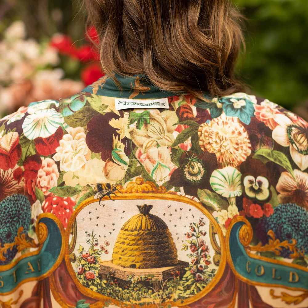 
                  
                    Model wearing Stay Gold Pixie Duster featuring wildflowers, bees, bunny rabbits and poetic vintage collage in cropped length – Market of Stars
                  
                