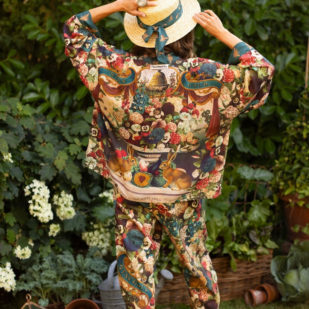 
                  
                    Model wearing Stay Gold Pixie Duster featuring wildflowers, bees, bunny rabbits and poetic vintage collage in cropped length – Market of Stars
                  
                