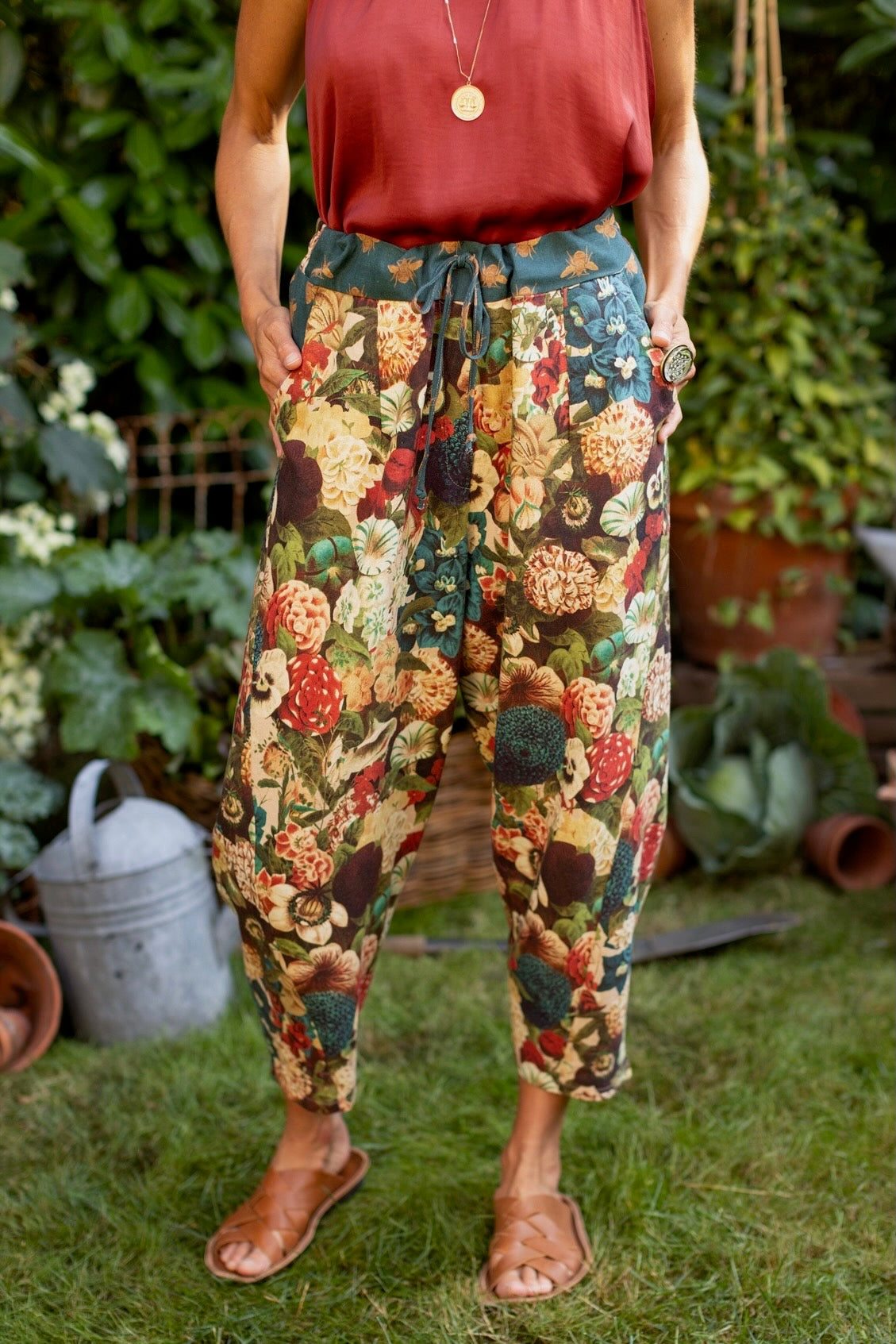 Model wearing Stay Gold linen Artist Pants with lantern hem and floral collage featuring vintage wildflower, bee, and rabbit illustrations – Market of Stars