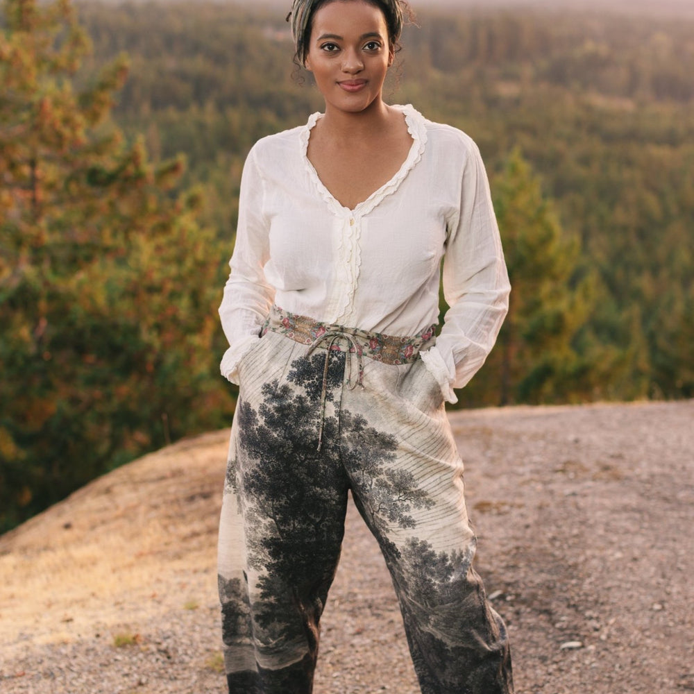 
                  
                    Linen Still I Rise Artist Pants with lantern hem, featuring antique landscape etchings in a rich, layered print celebrating resilience – Market of Stars
                  
                