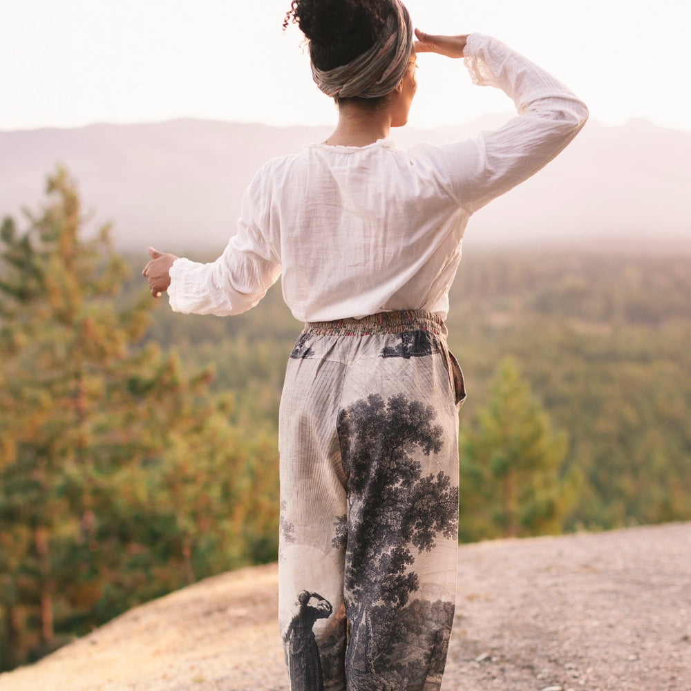 
                  
                    Linen Still I Rise Artist Pants with lantern hem, featuring antique landscape etchings in a rich, layered print celebrating resilience – Market of Stars
                  
                