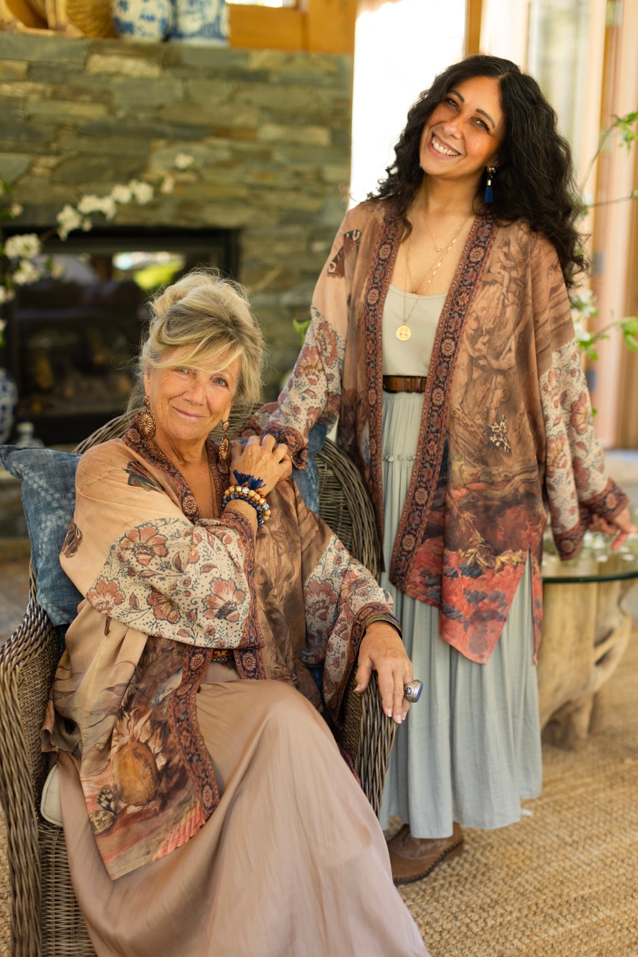 Model(s) wearing The Storyteller -- a mid-length Matinée kimono duster featuring antique artwork and vintage prints from around the world -- Market of Stars