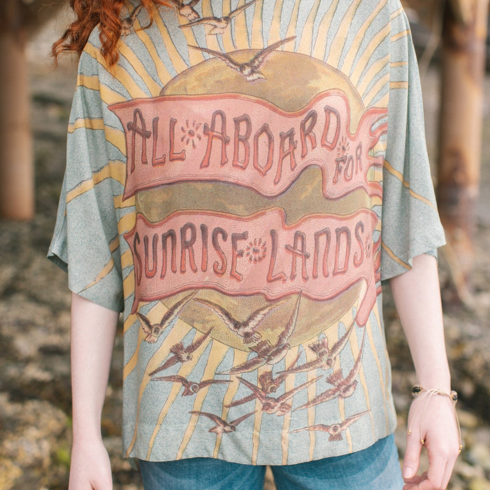 
                  
                    Soft bamboo-based tee featuring antique nautical artwork with shells, sunshine, and mermaid – Market of Stars
                  
                